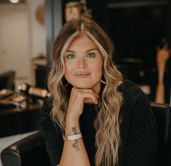 Abbie Young sitting in salon studio